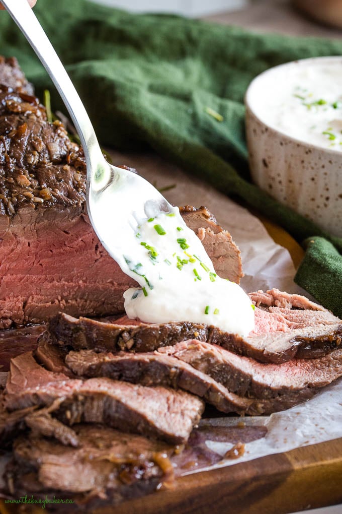roasted beef tenderloin slices with a spoonful of horseradish sauce