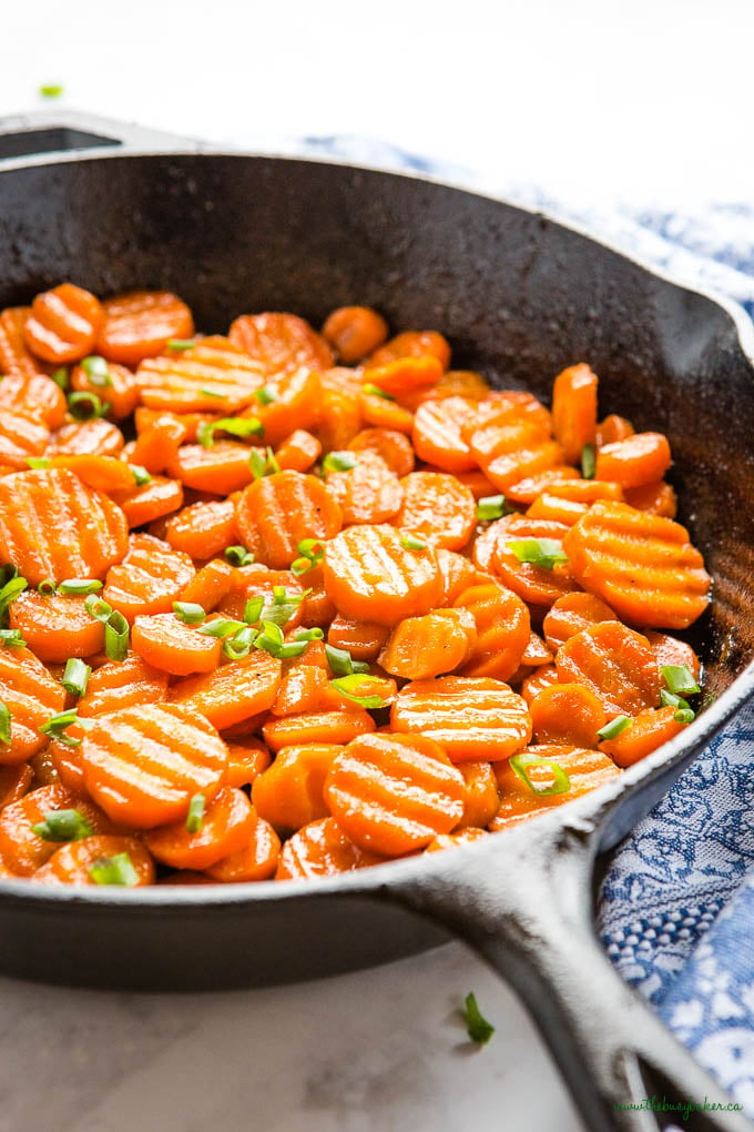 honey glazed carrots side dish in cast iron pan