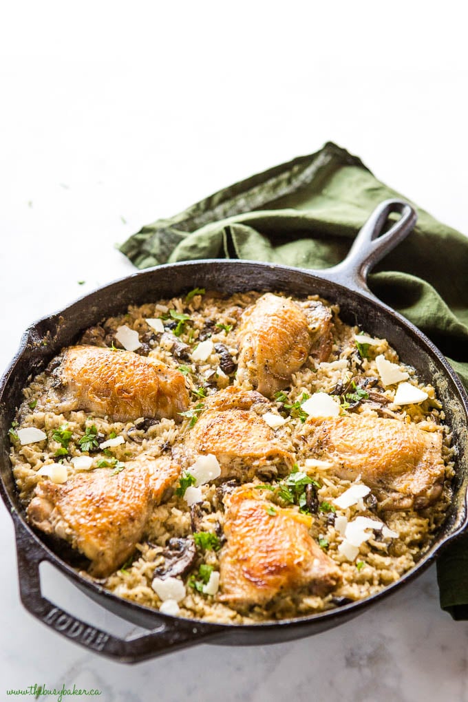 Lodge cast iron pan with crispy chicken and creamy rice bake, and fresh herbs