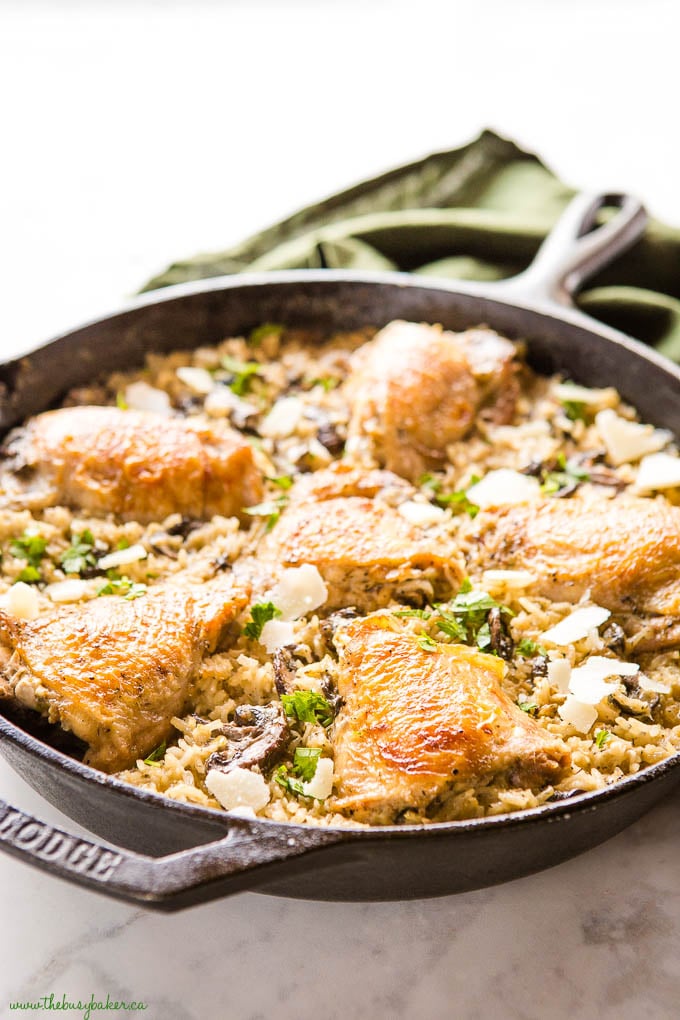 crispy chicken in cast iron pan with mushroom rice