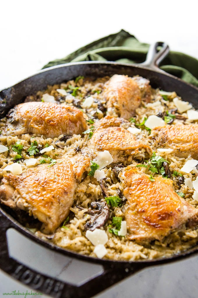 crispy skinned chicken thighs cooked in mushroom rice with parmesan cheese