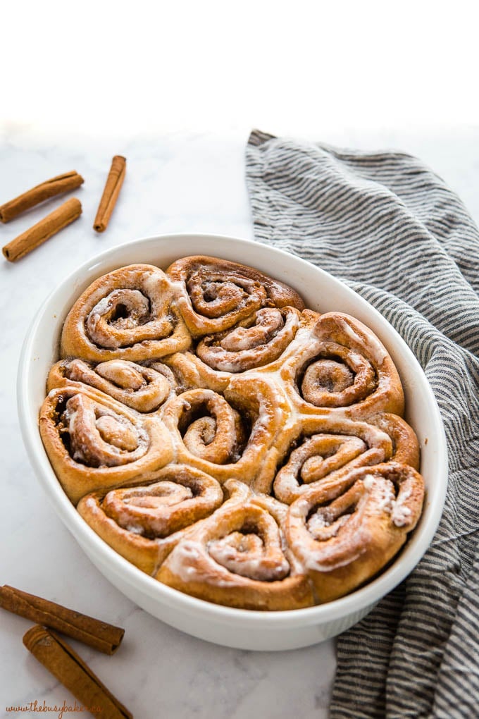 white baking dish with homemade whole wheat cinnamon rolls