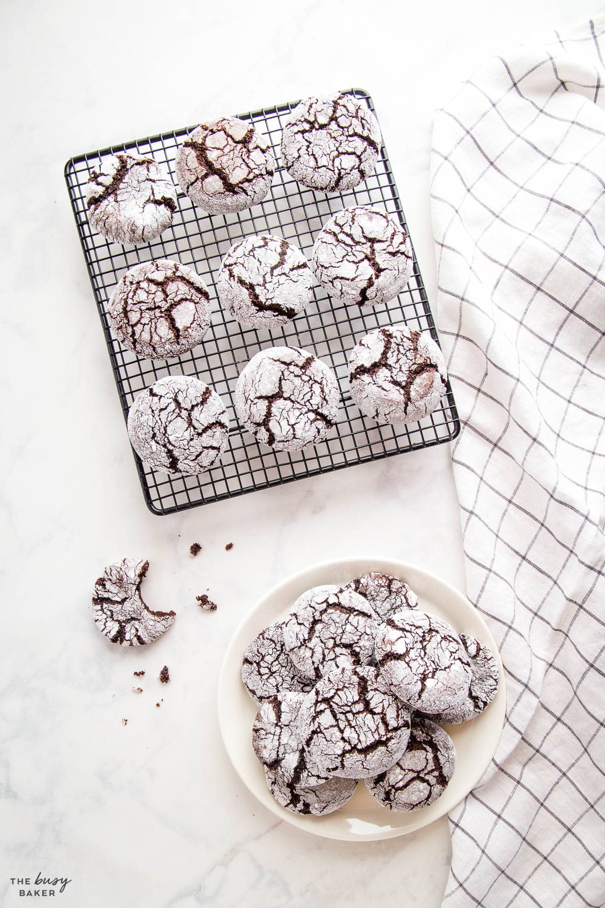 overhead image: chocolate crinkle cookies on a plate and a cooling rack