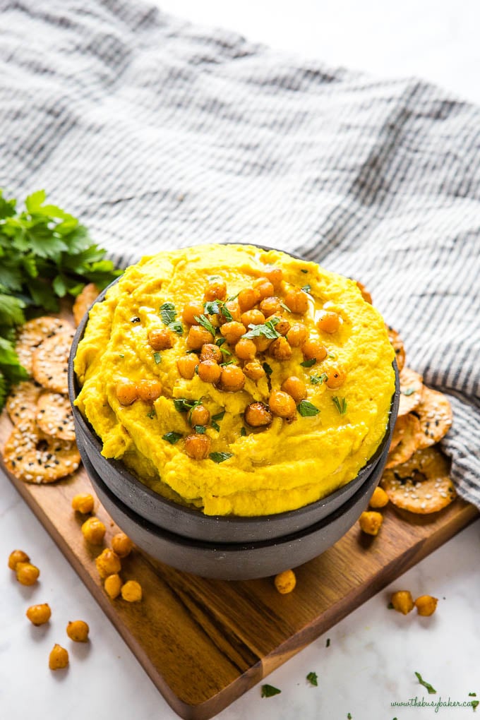 golden turmeric hummus with roasted chickpeas and fresh herbs