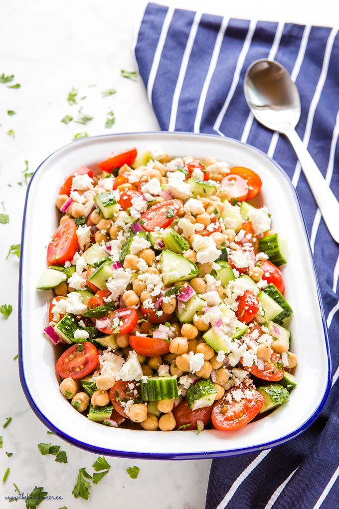 Greek Chickpea Salad in white bowl with blue rim