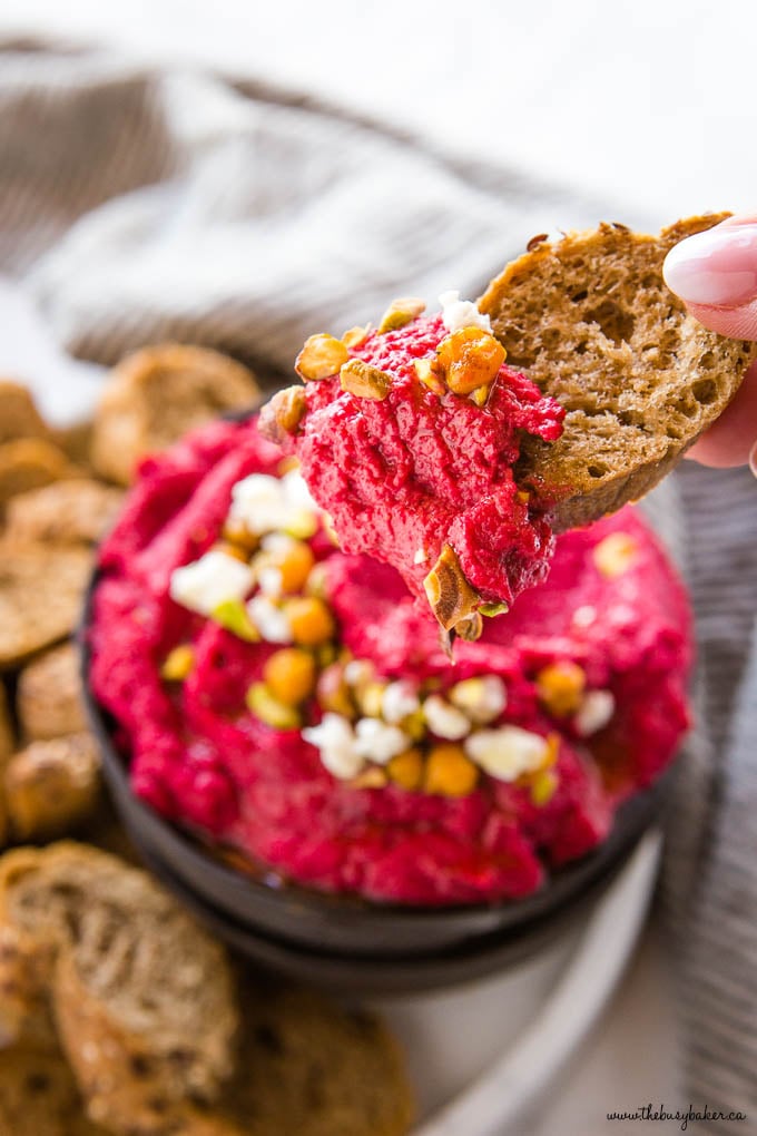 multigrain baguette slice with roasted beet hummus