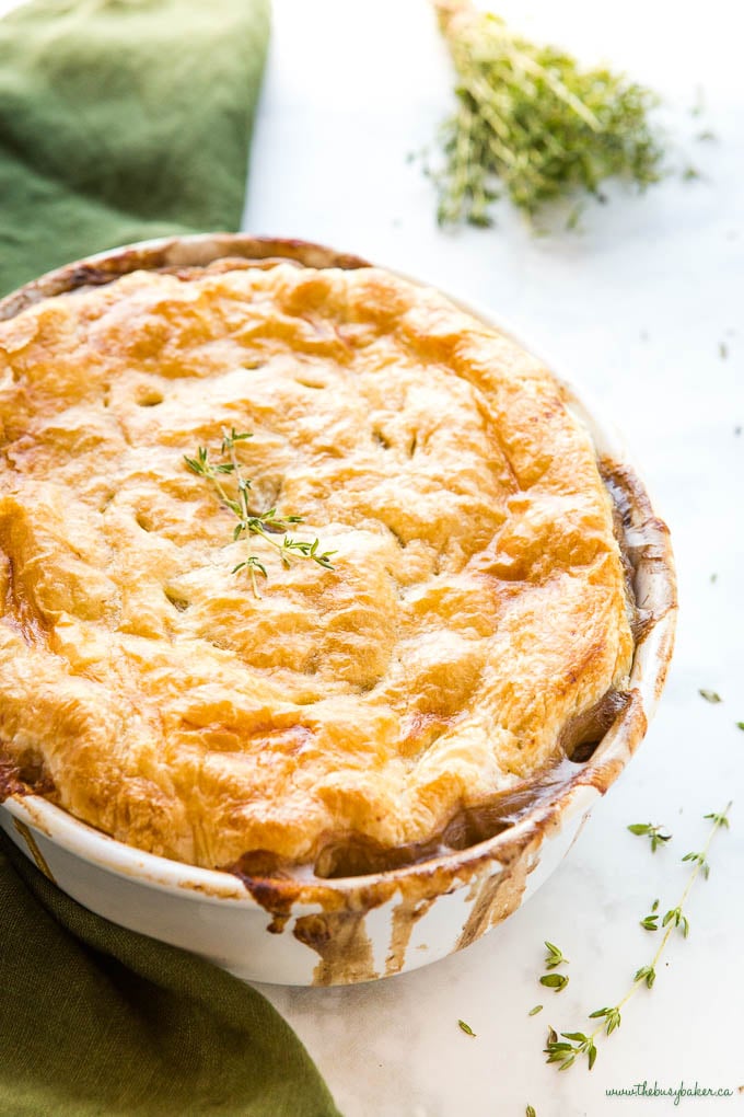 vegetarian mushroom pot pie in white baking dish with fresh thyme