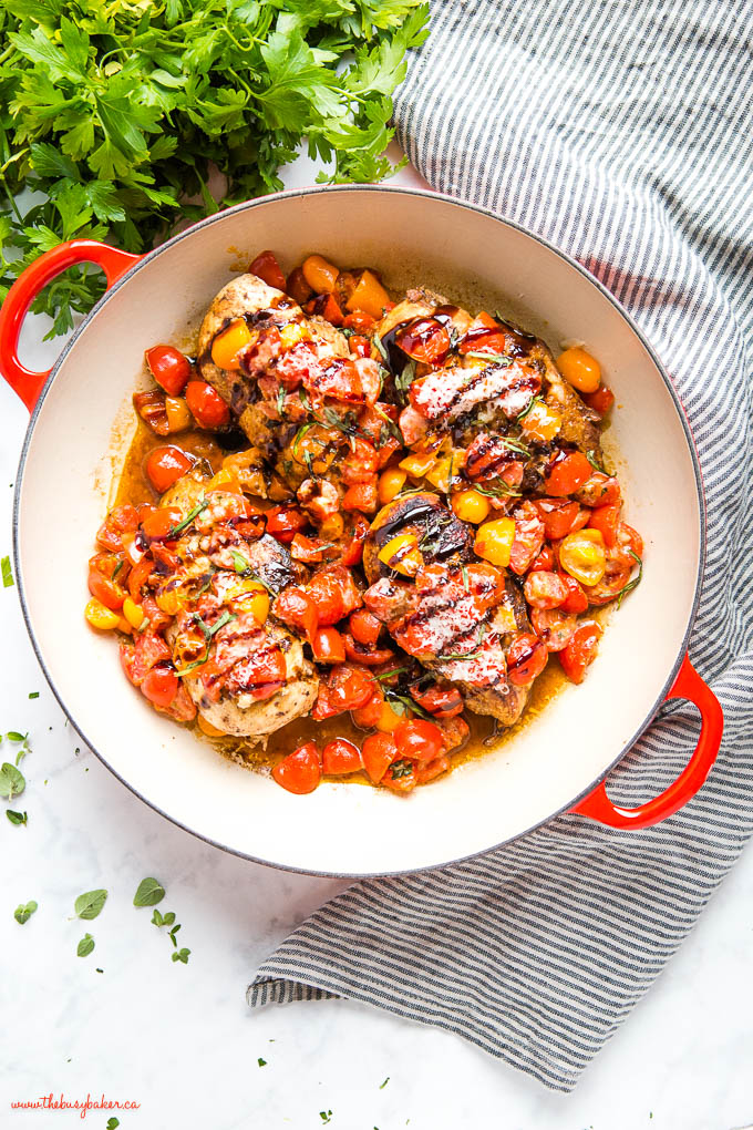 overhead image: baked balsamic chicken with fresh tomatoes and parmesan