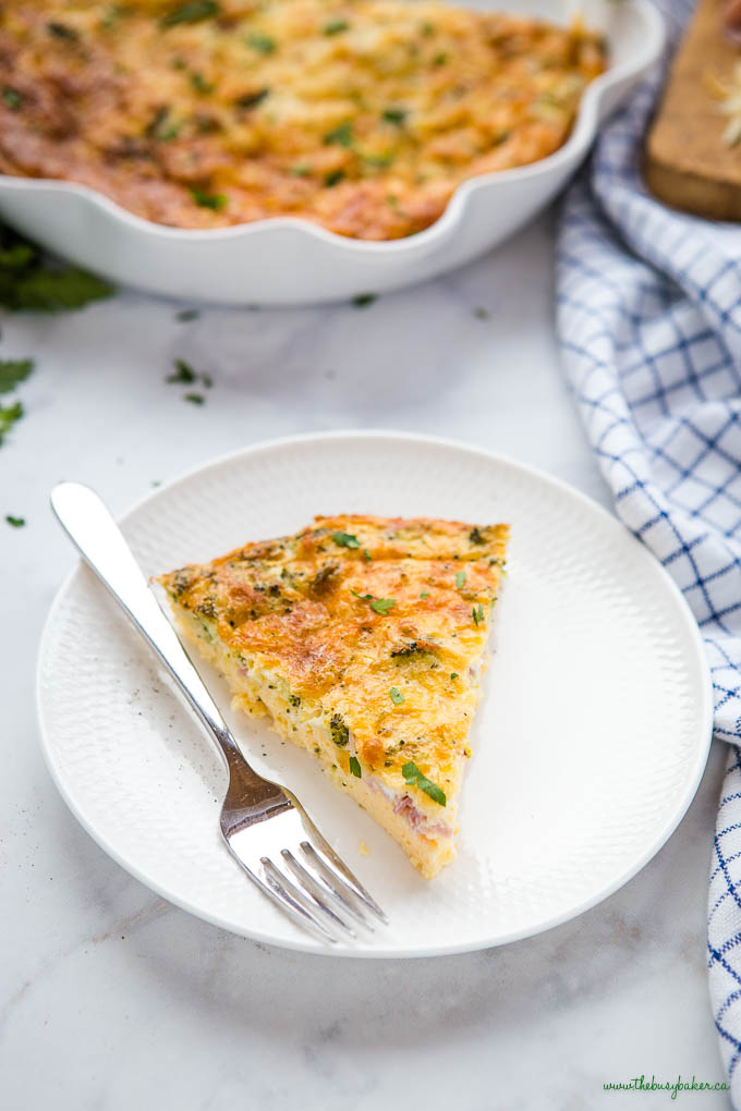 slice of ham and broccoli low carb quiche on white plate