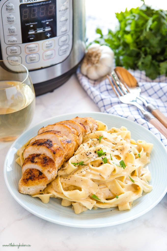 plate of Fettuccine Alfredo with grilled chicken