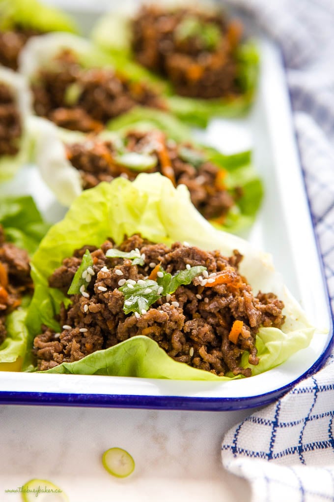 closeup image: low carb beef lettuce wrap with carrots and green onions