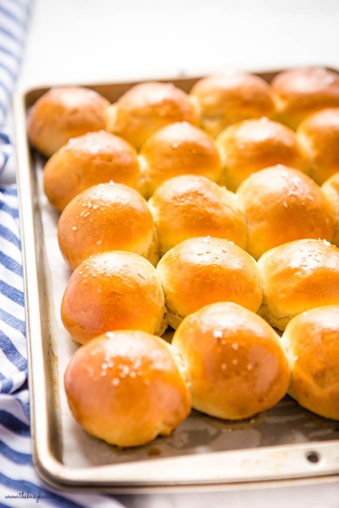 golden brown dinner rolls on baking tray