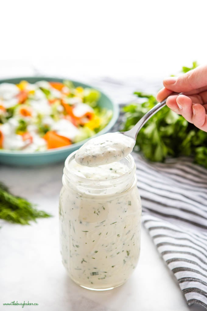 spoonful of ranch dressing from a mason jar