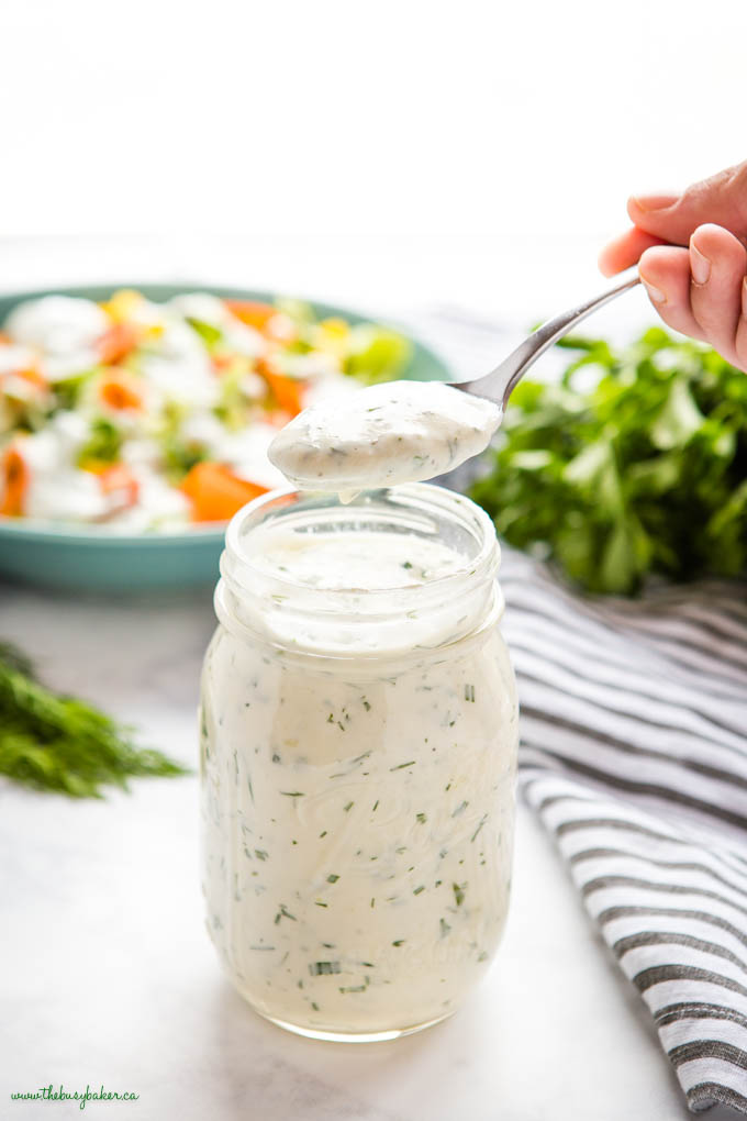 spoonful of ranch dressing from a mason jar