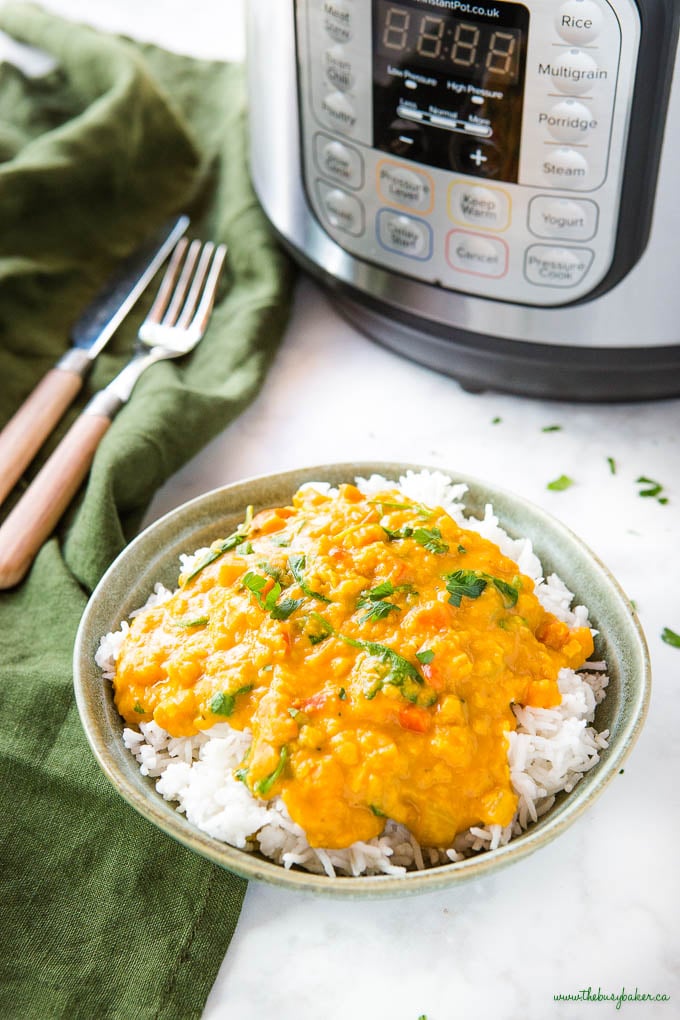 bowl of instant pot curry with lentils over rice 