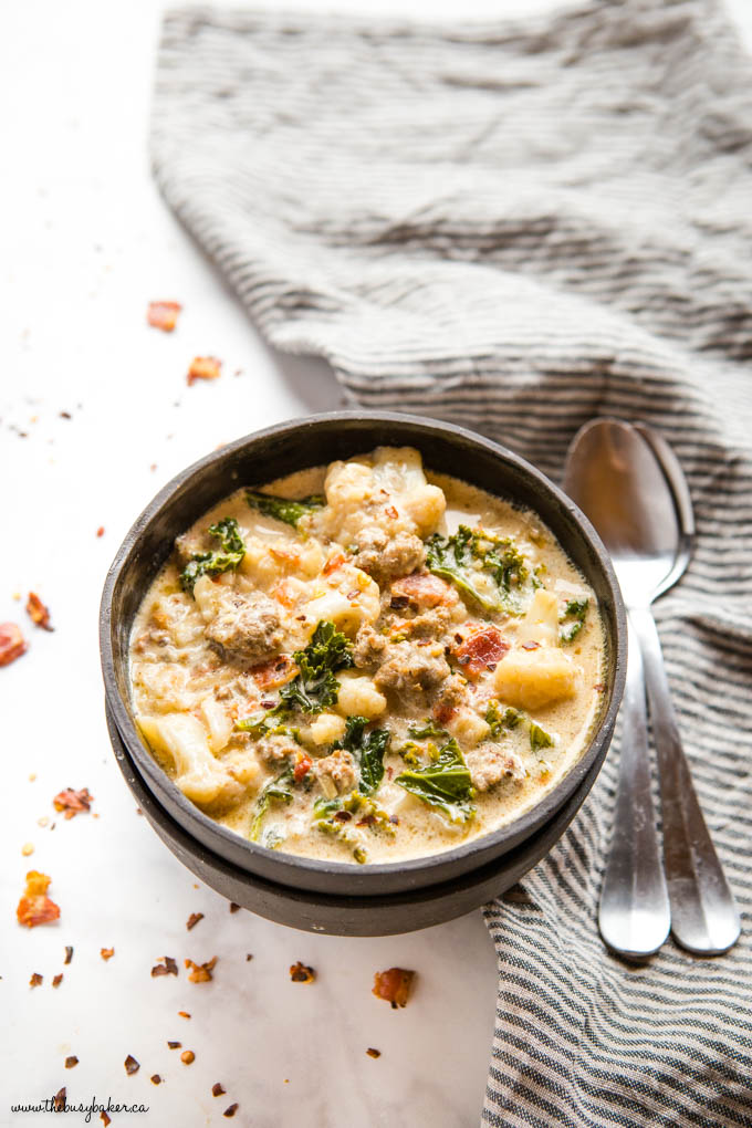 keto zuppa toscana in black bowl with spoon