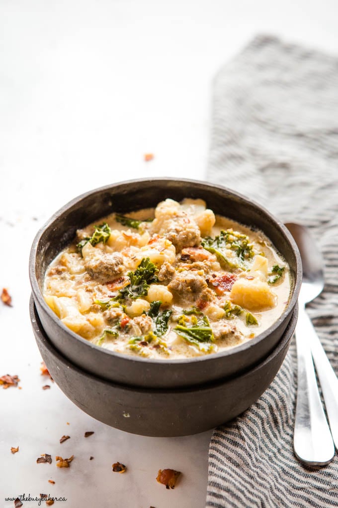 keto zuppa toscana in black bowls with spoons