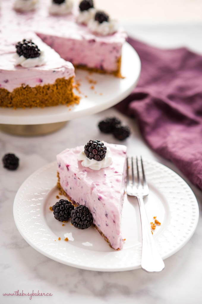 slice of berry cheesecake on white plate