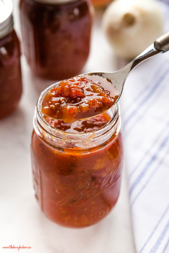 closeup image: spoonful of homemade tomato pickle