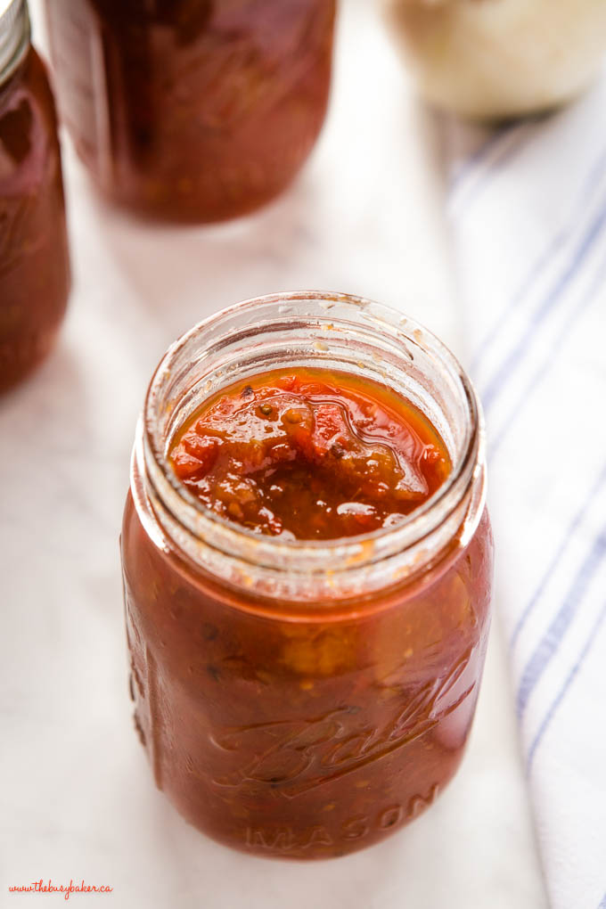 closeup image: mason jar of tomato pickle