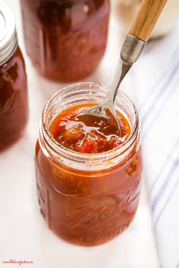 spoon in mason jar of homemade tomato pickle