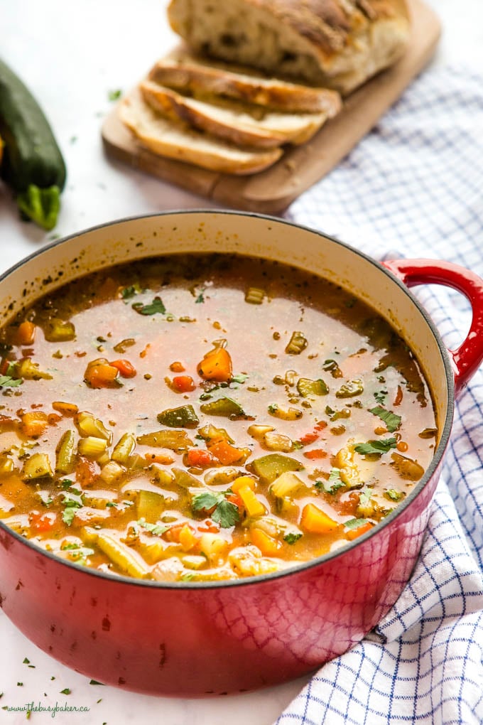 red cast iron pot with vegetable soup