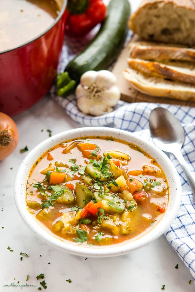 bowl of vegetable soup with fresh chopped herbs