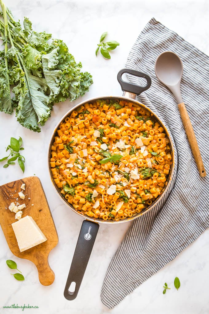 vegetarian pasta with fresh basil, fresh kale, and white beans