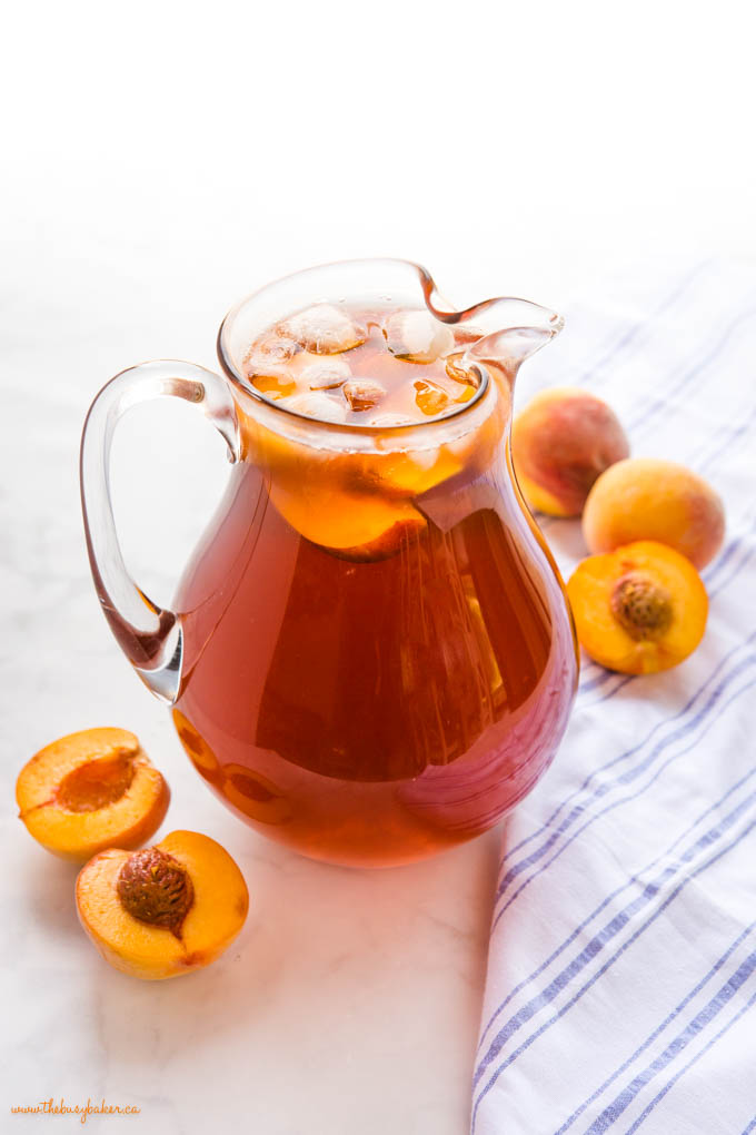 pitcher of peach tea with ice