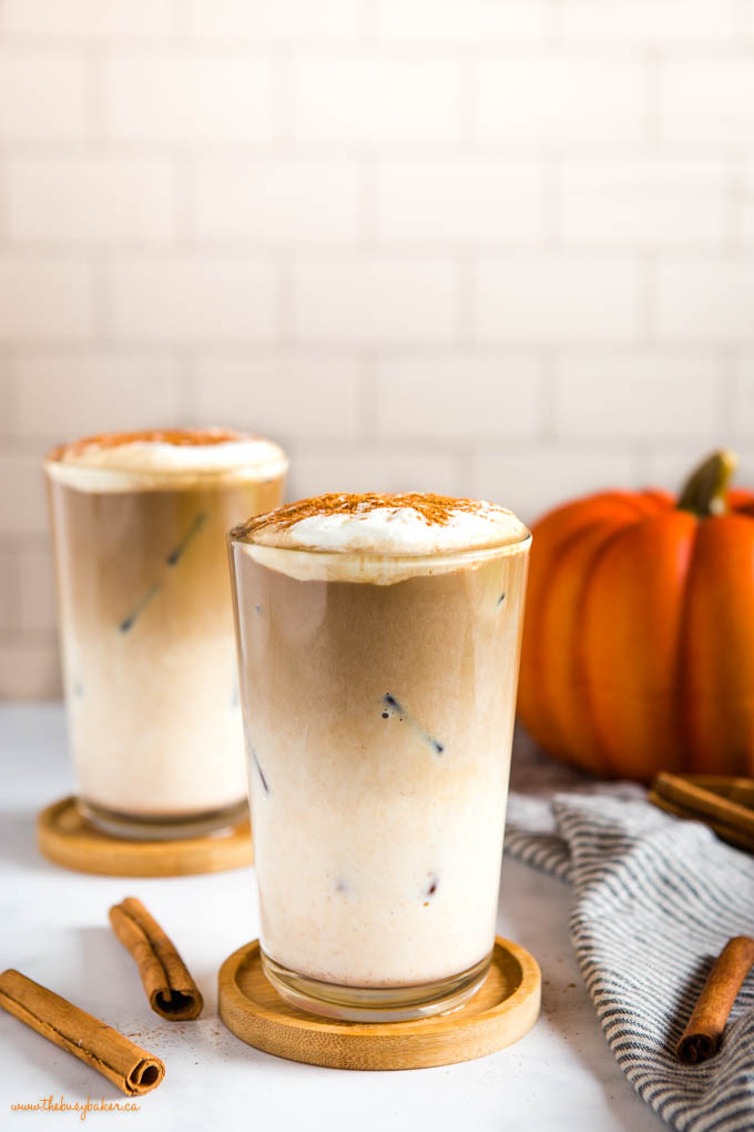 layers of milk, espresso and foam in pumpkin spice iced latte