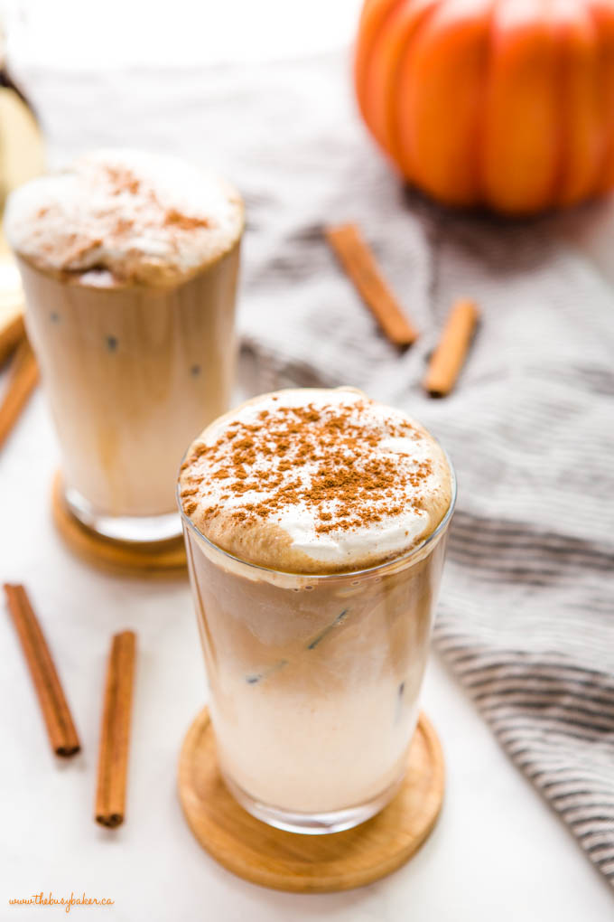 pumpkin spice iced latte with layers of milk and foam