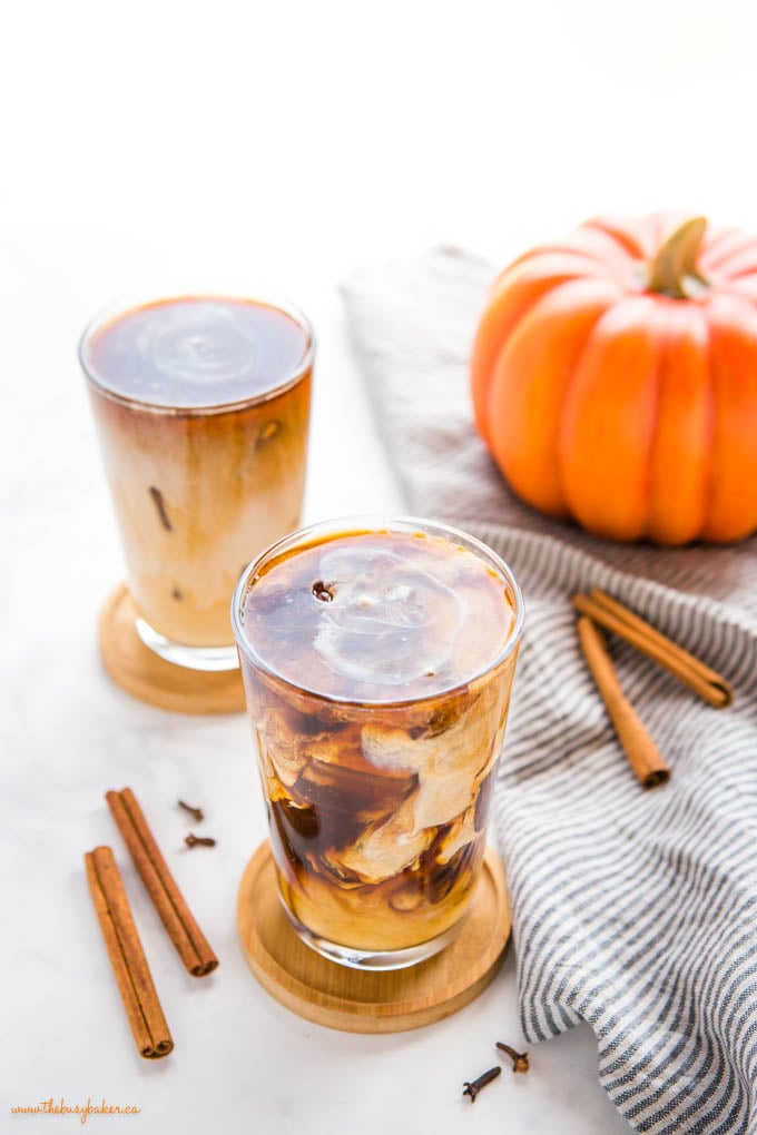 This Starbucks Pumpkin Cream Cold Brew is the perfect pumpkin spice iced coffee drink - easy-to-make cold brew coffee sweetened with a simple pumpkin cream made in a mason jar! Skip the coffee shop and make your favourite Pumpkin Cream Cold Brew at home! Recipe from thebusybaker.ca! #pumpkincreamcoldbrew #pumpkinspicelatte #pumpkinspice #pumpkin #fall #easytomake #coffee #homemade #starbucks #copycat starbucks pumpkin cream cold brew recipe
