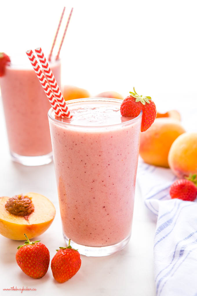 pink smoothie with strawberries and peaches