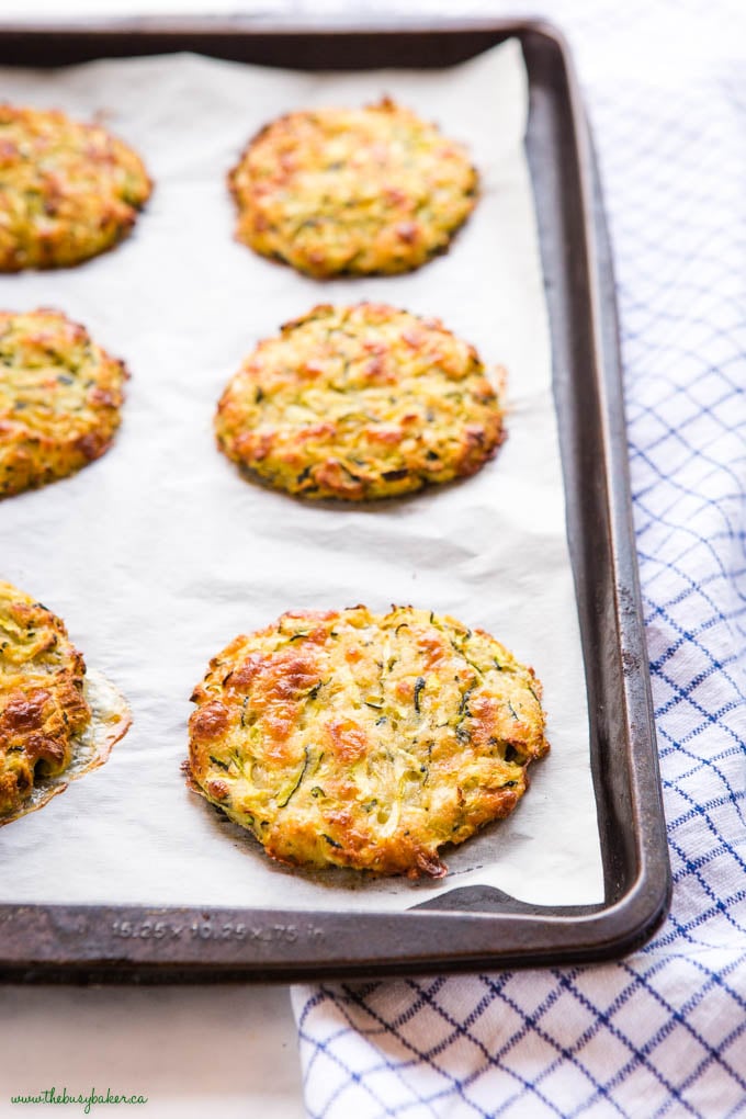 baking sheet with baked zucchini fritters