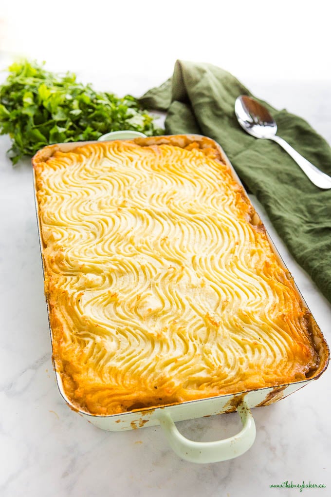 green pan with cottage pie, topped with crispy mashed potatoes