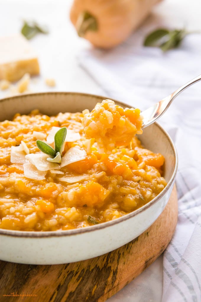 risotto alla zucca in bowl with fork
