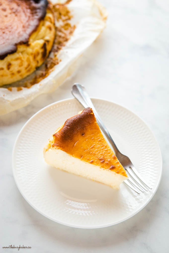 slice of san sebastian cheesecake on a white plate