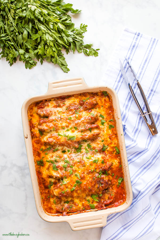 overhead image: baking dish with stuffed sausages in marinara sauce