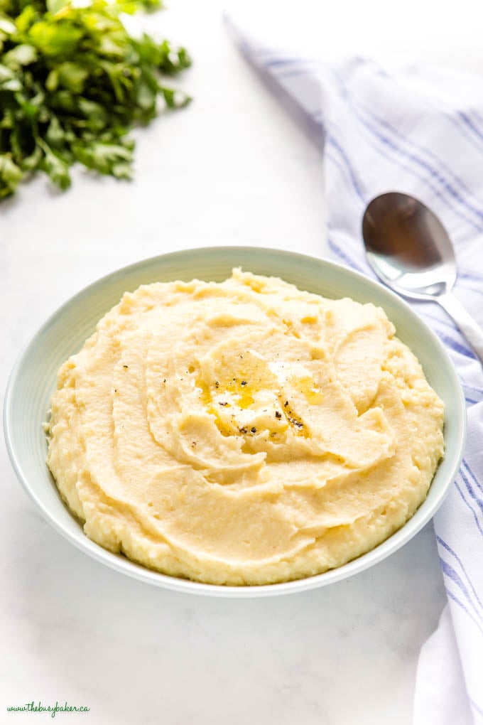 bowl of slow cooker mashed potatoes with butter and pepper