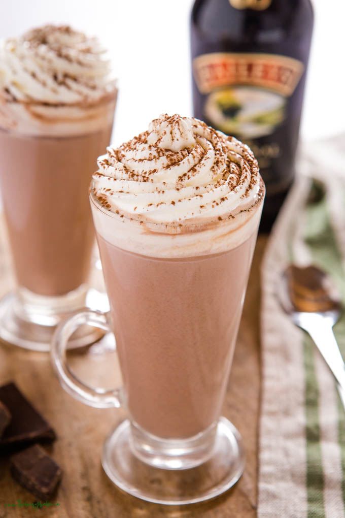 Hot Chocolate with Baileys in a tall glass mug with whipped cream