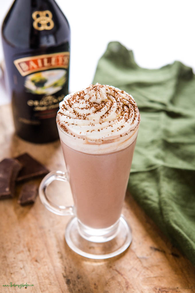 hot chocolate with baileys irish cream in a glass mug with whipped cream