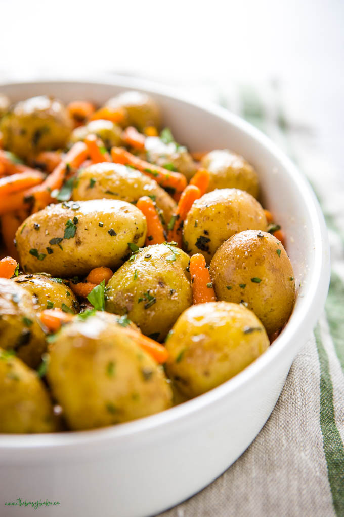 closeup image: roasted potatoes and carrots with fresh herbs