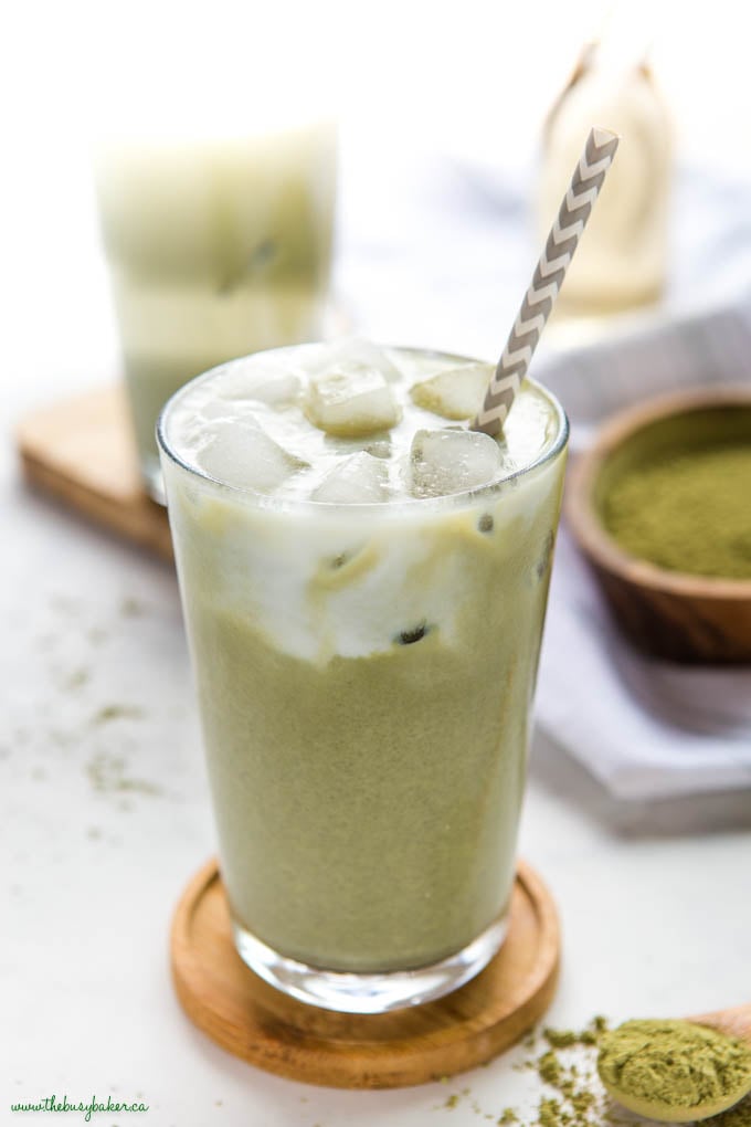 iced matcha latte in glass with paper straw