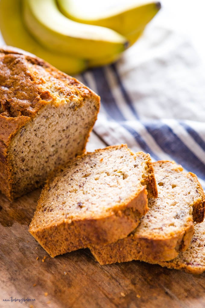 slices of vegan banana bread on a wooden board