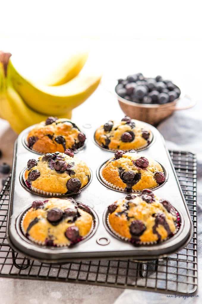 muffin tin with banana blueberry muffins