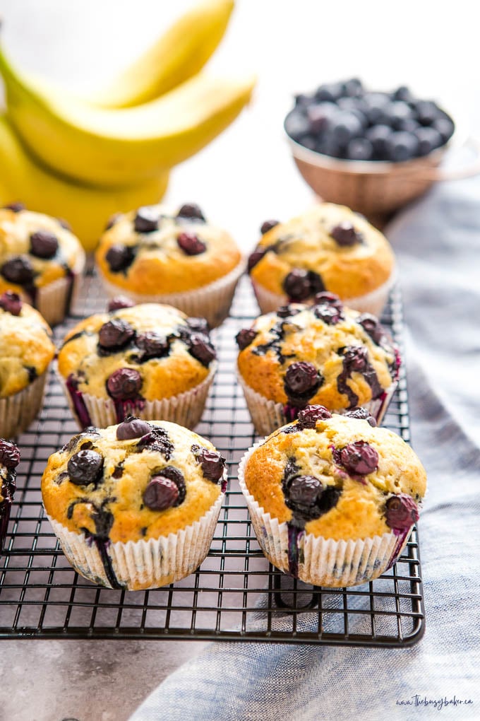 banana blueberry muffins on wire cooling rack