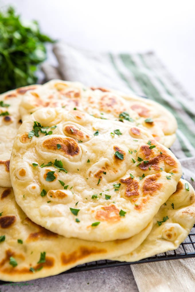 naan bread on black cooling rack 