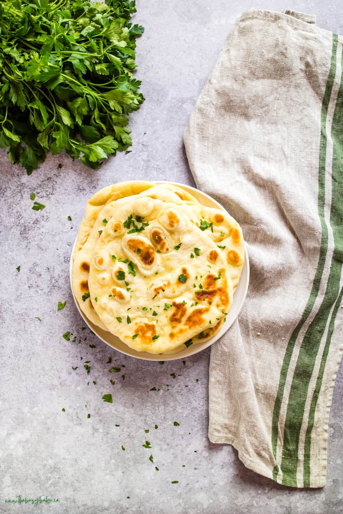 overhead image: stack of naan bread on plate