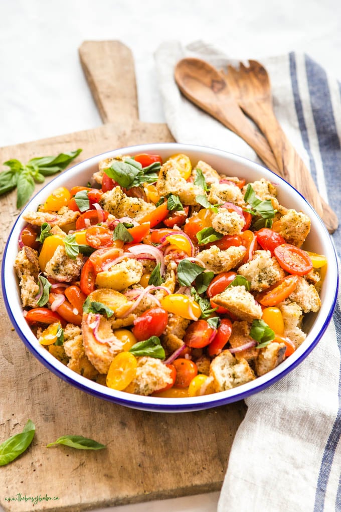 panzanella salad in white bowl with blue rim