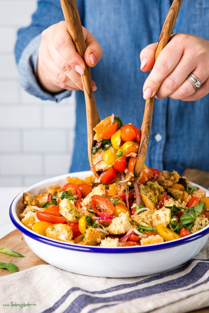 This Panzanella Salad is the perfect fresh, flavourful and filling salad made in the classic Italian way - with toasted bread, juicy tomatoes, and fresh herbs! Recipe from thebusybaker.ca! #panzanellasalad #italian #breadsalad #salad #healthy #vegetarian #vegan #lunch via @busybakerblog